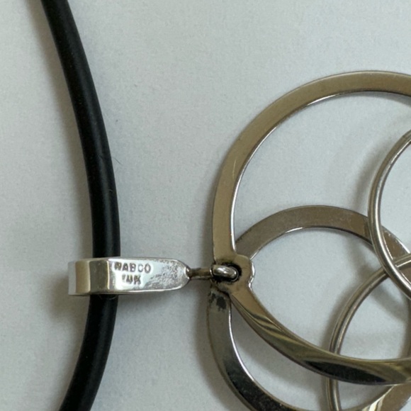 14k stamped white gold geometric pendant on a black rubber cord, gold clasp. - Picture 5 of 6